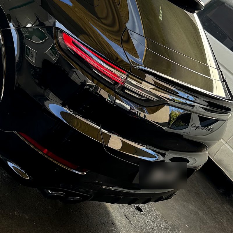 Polished rear quarter and tail light after a hand wax and polish