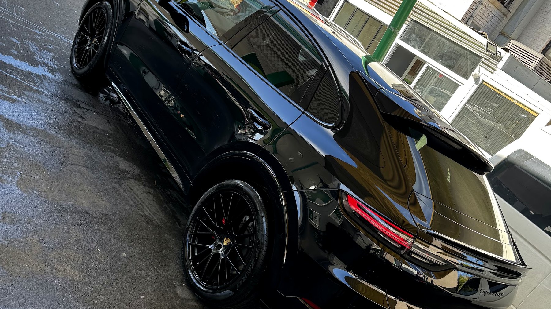 A gloss black Porsche Macan GTS freshly hand washed at Flemington Hand Car Wash