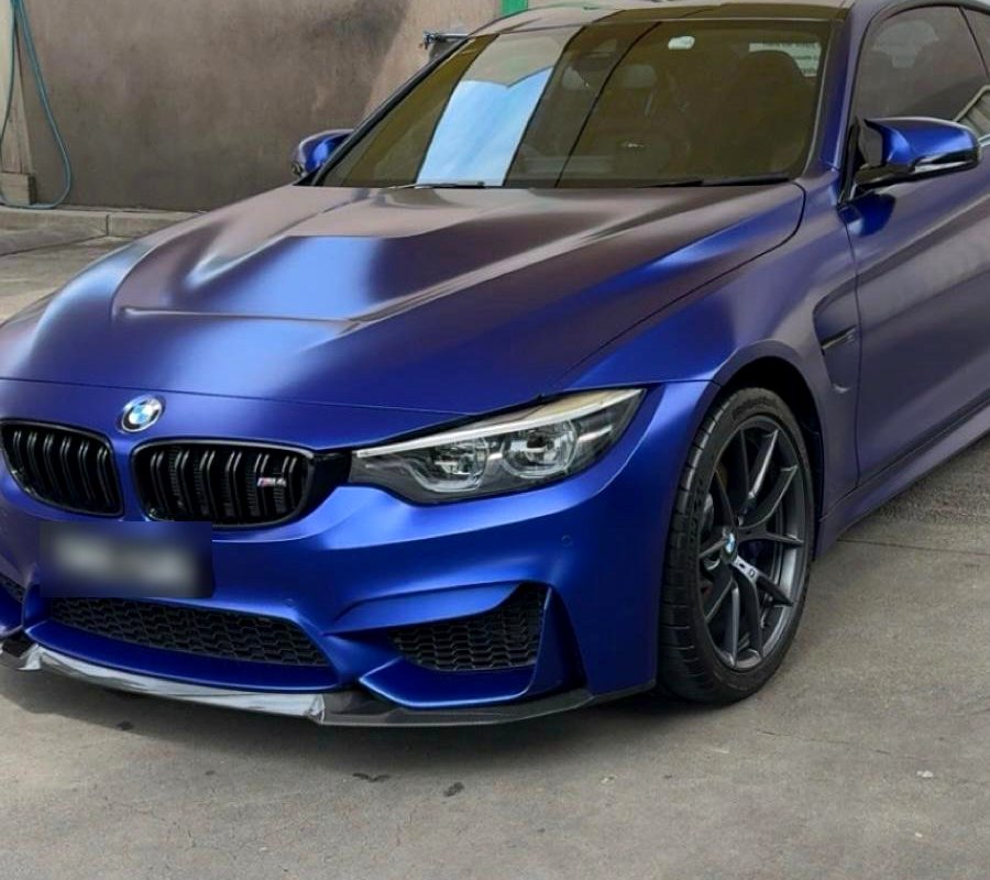 Matte blue BMW M4 after a hand wash and polish at Flemington Hand Car Wash